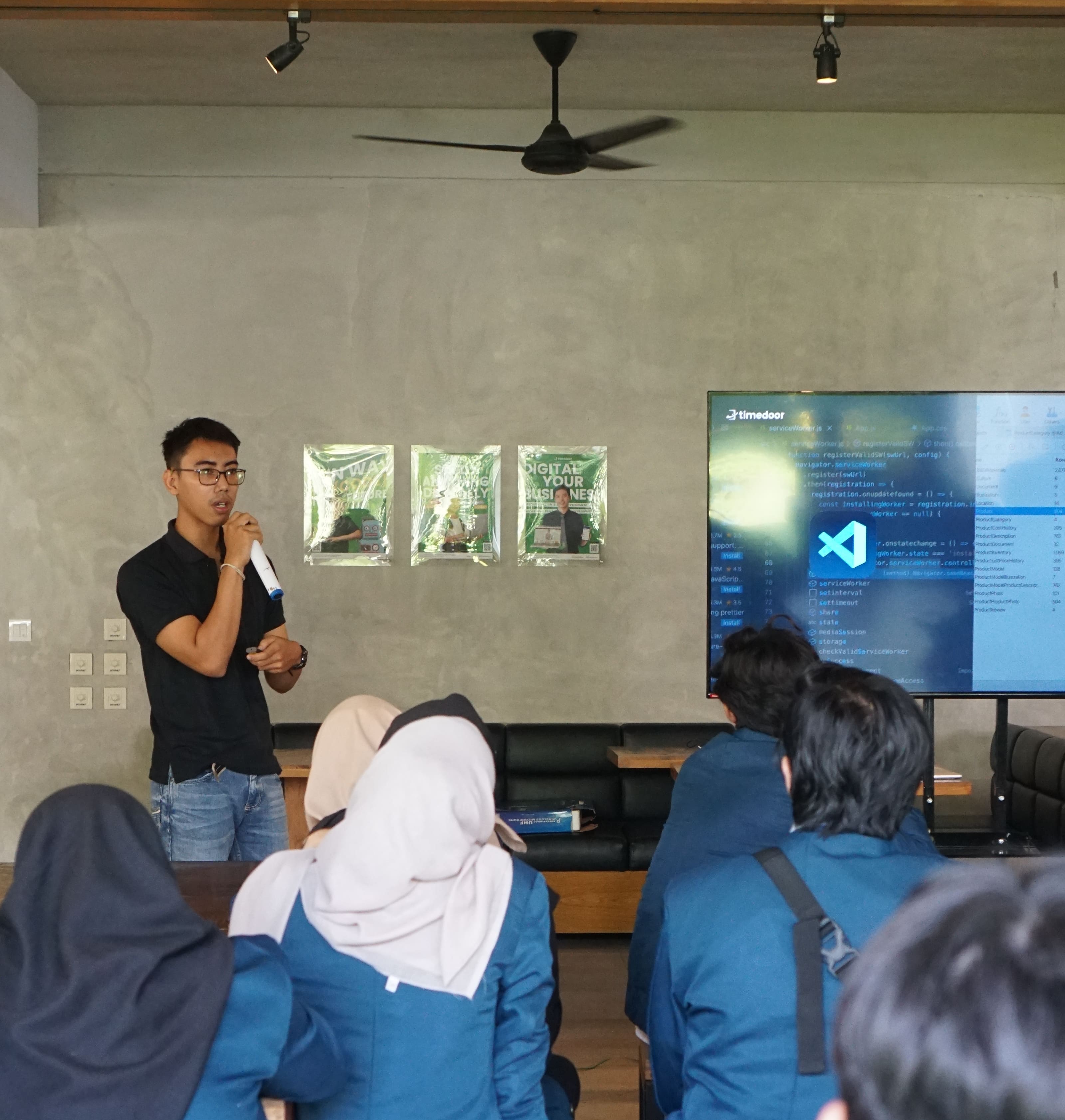 Deva speaking with students